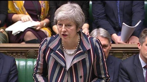 Theresa May to join EU summit after surviving no-confidence vote