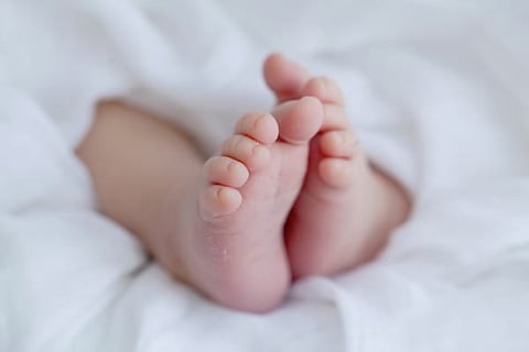 She is just a 2 hours old infant and holds all her official government documents!