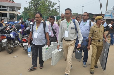 Polling officials receive EVMs and VVPATs for Guwahati Lok Sabha Election at Maniram Dewan Trade Centre