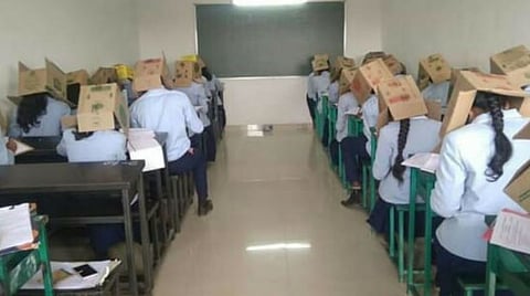 Students were made to put cardboard boxes to curb cheating in Karnataka