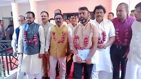 MLAs of Opposition Congress in Assam staged protest at Assembly wearing garlands of onions