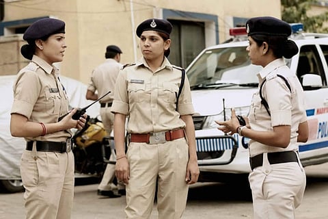 Three police personnel show their softer side while on duty