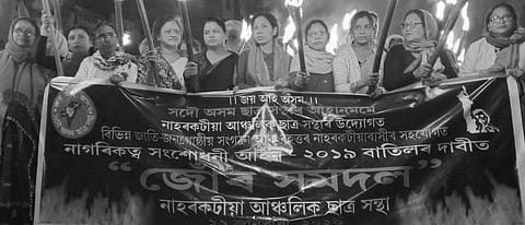 Massive torchlight rally by AASU, AJYCP against CAA in Naharkatia