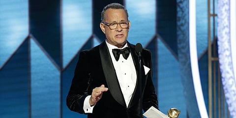 Actor Tom Hanks has a tearful moment on stage at the Golden Globe