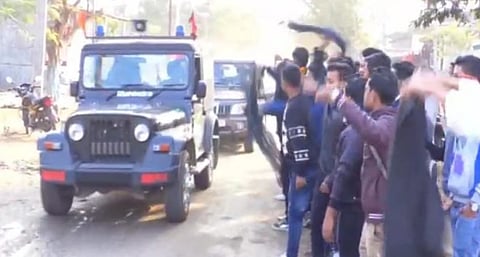 AASU activists show black flags to Minister Pijush Hazarika in Sarupathar