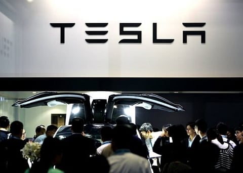 Electric automaker Tesla challenges hackers to find bugs and win Model 3 car