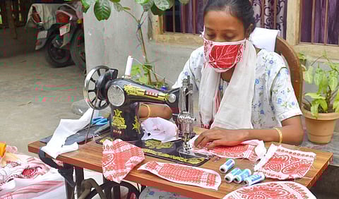 Masks made from gamosa distributed among children in Lakhimpur