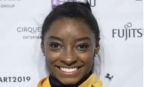 Biles takes aim at USA Gymnastics in birthday tweet