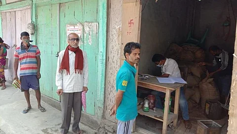 Citizens throng ration shops to get free rice maintaining social distancing norms