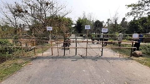 Morigaon People put up temporary bamboo barricades