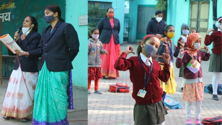 School classroom replenished with students wearing masks, sweaters and hats