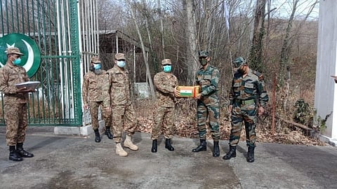 Indian and Pakistani Army officials exchange sweets on border on new year