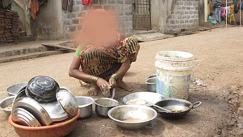 Old women cleanning pots