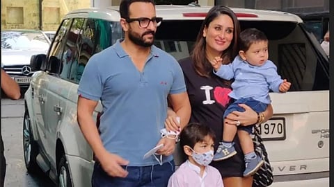Saif Ali Khan posing for paparazzi with wife Kareena Kapoor and sons Taimur and Jehangir Ali Khan.