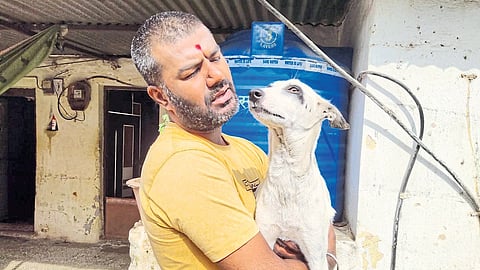 Purushottam Awhad with Saved Dog