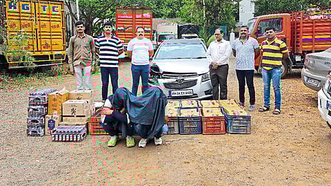 criminal arrested with seized liquor