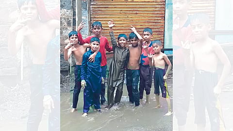 Children enjoying the first rain