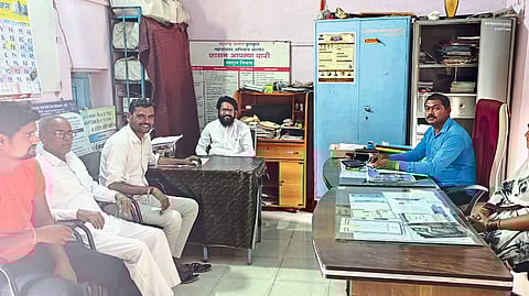 Officers and members discussing the ban on tree felling at the monthly meeting of the Gram Panchayat
