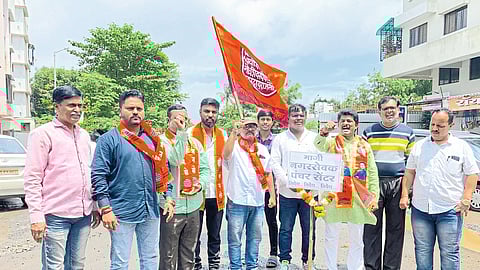 MNS officials naming the potholed road as Ex Corporator Puncture Centre.