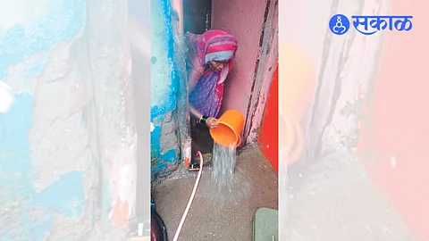 An elderly woman draws water from a house Latest rain update news