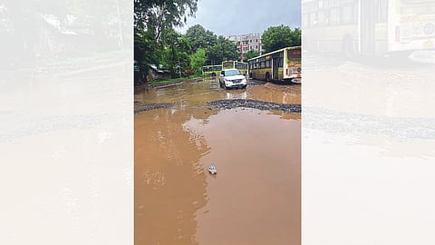 potholes in nimani bus stand latest rain news