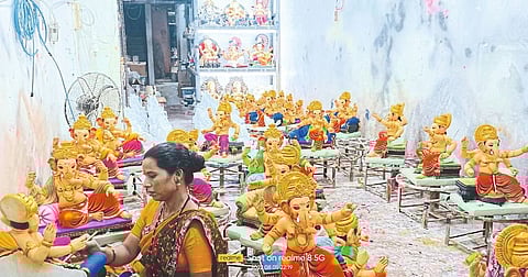 Sculptor Vidya Kumbhar putting the final touches on the idol as Ganeshotsav is just twenty-five days away.