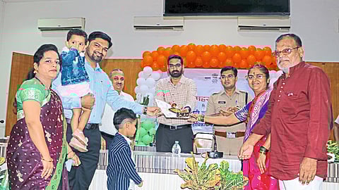 Collector Abhijit Raut felicitating the employees along with their families on the occasion of Revenue Day.