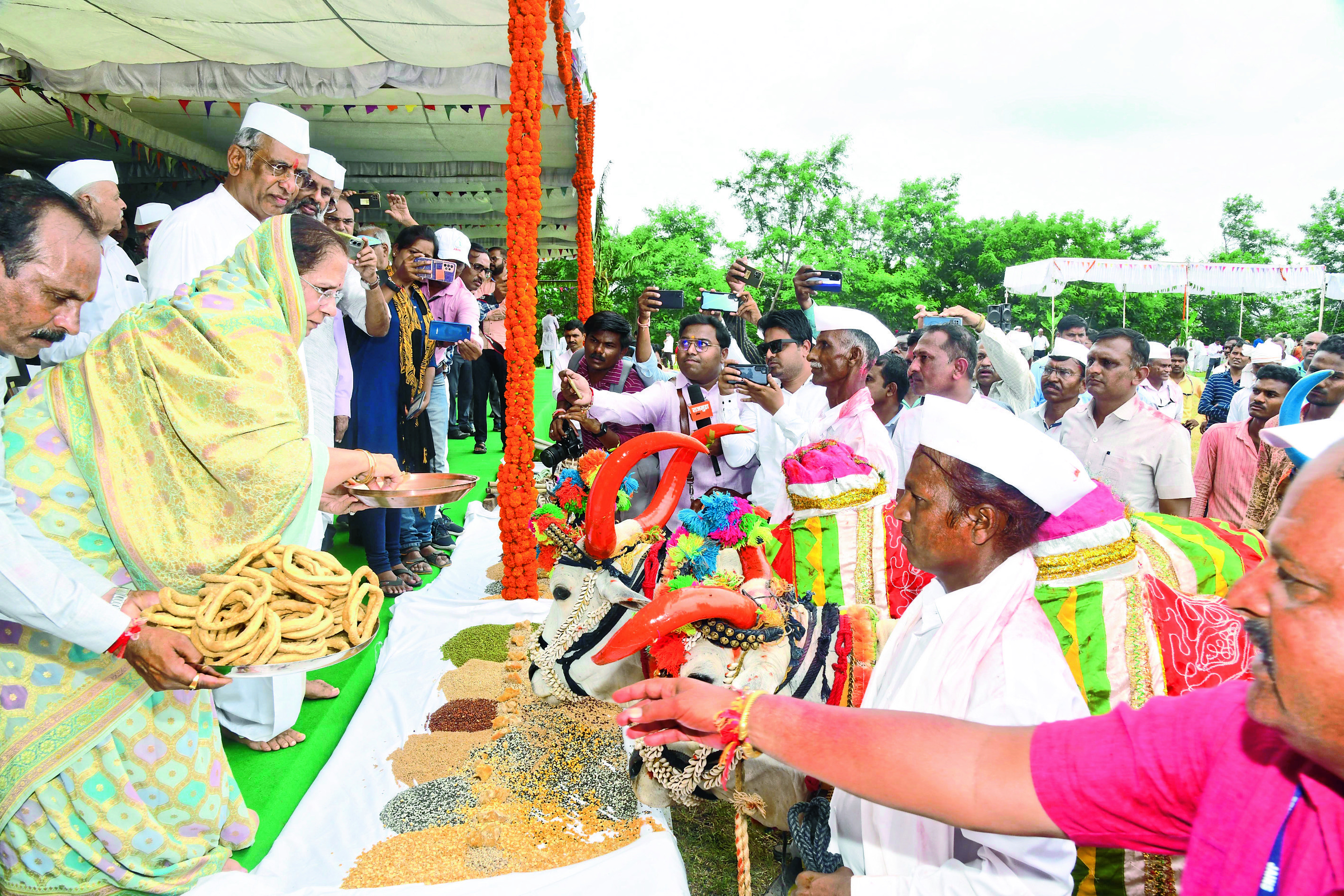 Jyoti and Ashok Jain worshiping Sarjaraja on the occasion of Polana celebrated at Jain Hills. Along with other members and dignitaries.