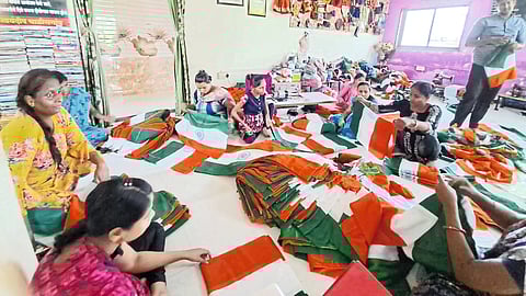 disabled women from Chalisgaon sewing the national flag.
