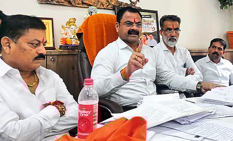 MLA Kishore Patil while giving information along with documents in a press conference regarding municipal plot reservation