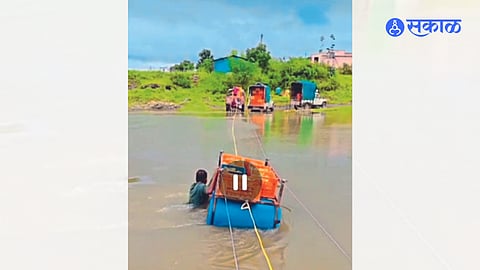 bridge built by farmers using empty plastic drums.