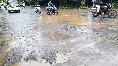 Rain formed ponds on the road leading to the Revenue Commissioner's office