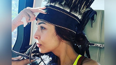 Malaika Arora drops a picture flaunting her big feather cap netizens trolled her