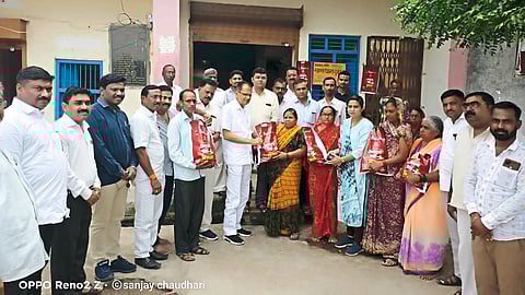 MLA Chimanrao Patil District Magistrate Vinay Gosavi Tehsildar Suchita Chavan Shaligram Gaikwad and officials while distributing the kit