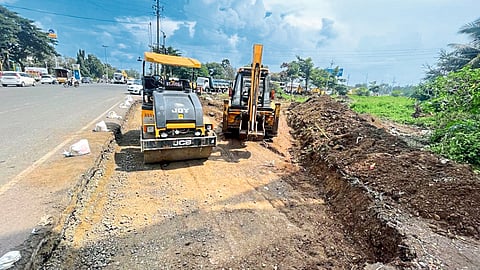 Road widening work is in progress along with road blockers at the accident site