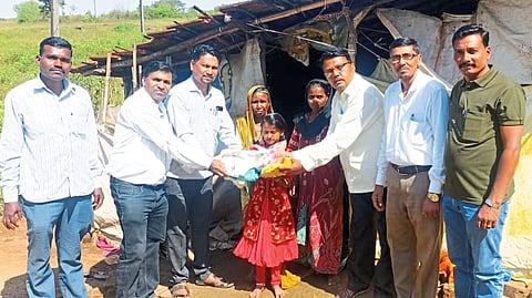 Municipal President Bharat Waghmare presents new clothes and sweets to Mohini and her mother and grandmother on the occasion of Diwali.