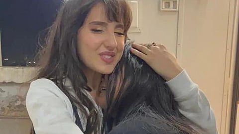 Nora Fatehi console crying fan, video viral, Netizens troll actress