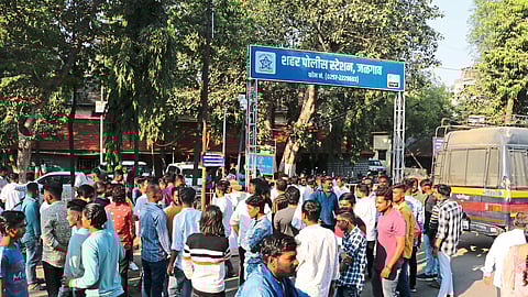 crowd gathered outside the city police station Jalgaon