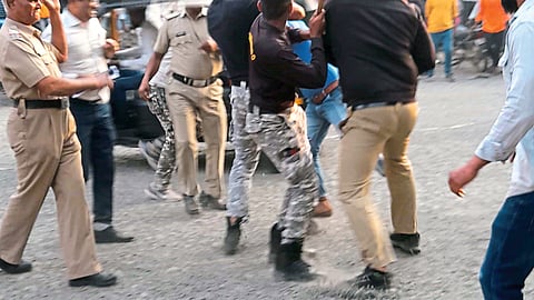 Police baton charge a youth who came to kill a suspect. In the second photo, police arresting one from the Govinda rickshaw stand.
