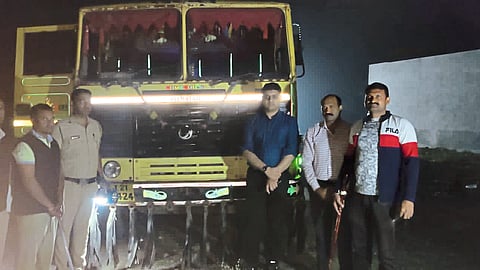 Collector Aman Mittal, Tehsildar Namdev Patil and revenue staff with the dumper seized in the area.