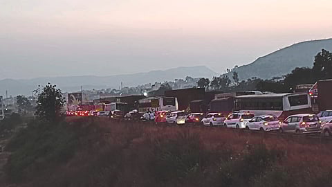Traffic jam on the bridge between Sinnar Phata and Khambale Shivara on Sunday.