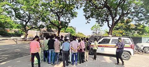 Ajanta Caves Tourists waiting for a bus at the parking lot