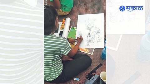 Students participating in the caricature drawing competition of 'Sakal-Yin' art festival organized at , MVP's MSW College