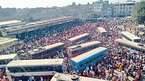 Crowd of passengers at the bus station here.