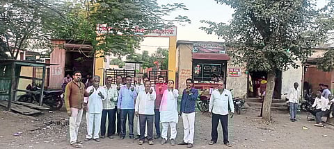 Balasaheb's Shiv Sena taluka chief Madhukar Patil, former sarpanch Sanjay Patil and villagers while voting by showing their hands at the polling station.
