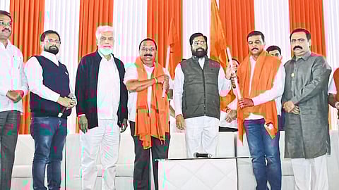 Bhausaheb Chaudhary, Sunil Patil during Balasaheb's entry into Shiv Sena in the presence of Chief Minister Eknath Shinde. Guardian Minister Dada Bhuse, MLA Suhas Kande are neighbors.
