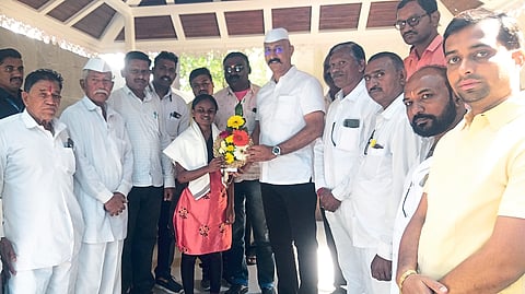 MLA Kunal Patil honoring disabled Suvarna Patil.