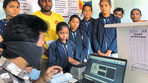 Students and parents taking Aadhaar card impressions at Bholenath Computer and Aadhaar Centre