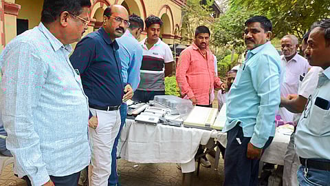 Tehsildar Namdev Patil, Naib Tehsildar Dilip Bari etc. while inspecting the process of sealing voting machines in Gram Panchayat elections.
