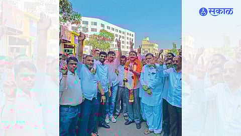 Supporters felicitating Bharat Kokate after he won the labor federation elections.